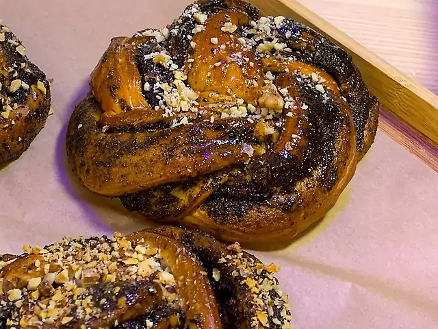 Bun with poppy seeds, nuts and raisins